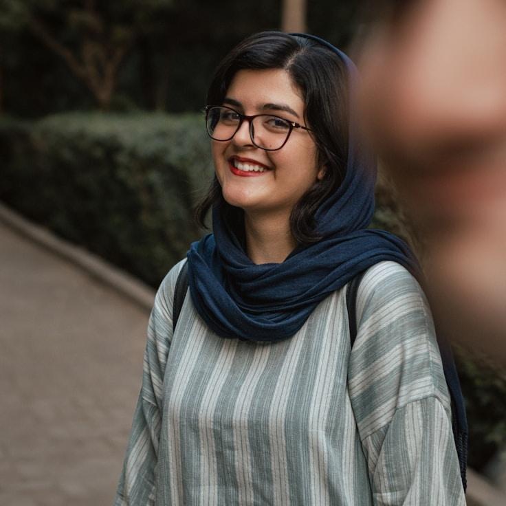 Alex Morgan, Lead Design Curator at Global Process Network, reviewing corporate floral arrangements